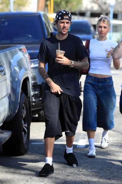 justin bieber walking with an iced coffee