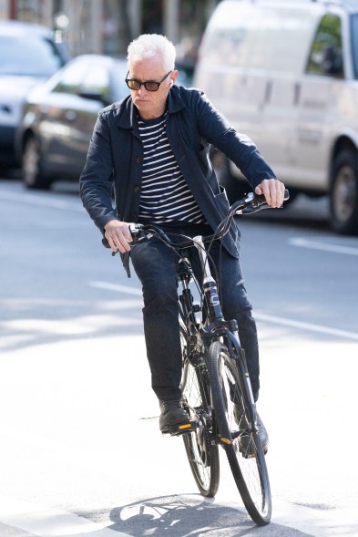 John Slattery riding a bike